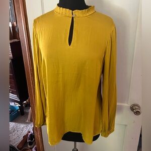 Womens blouse gold in color. Brand Loft size Medium